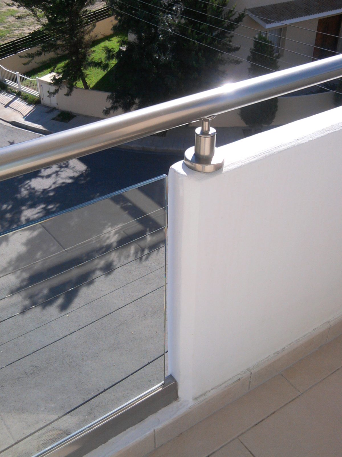 Glass balustrade with stainless handrail