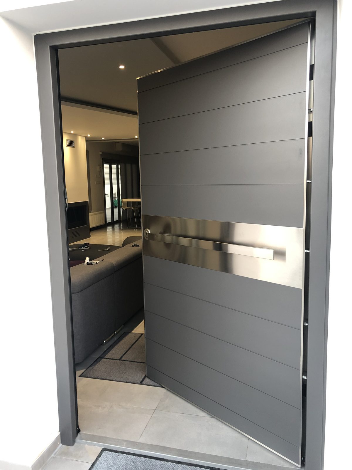 Oversized pivot entrance door, open