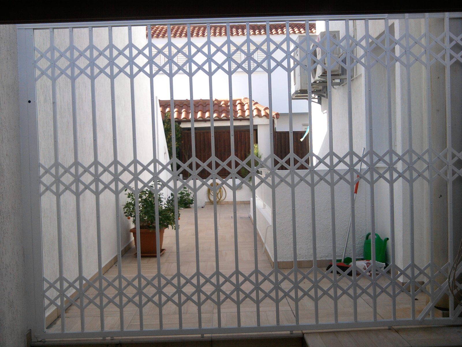 Concertina security grille, courtyard