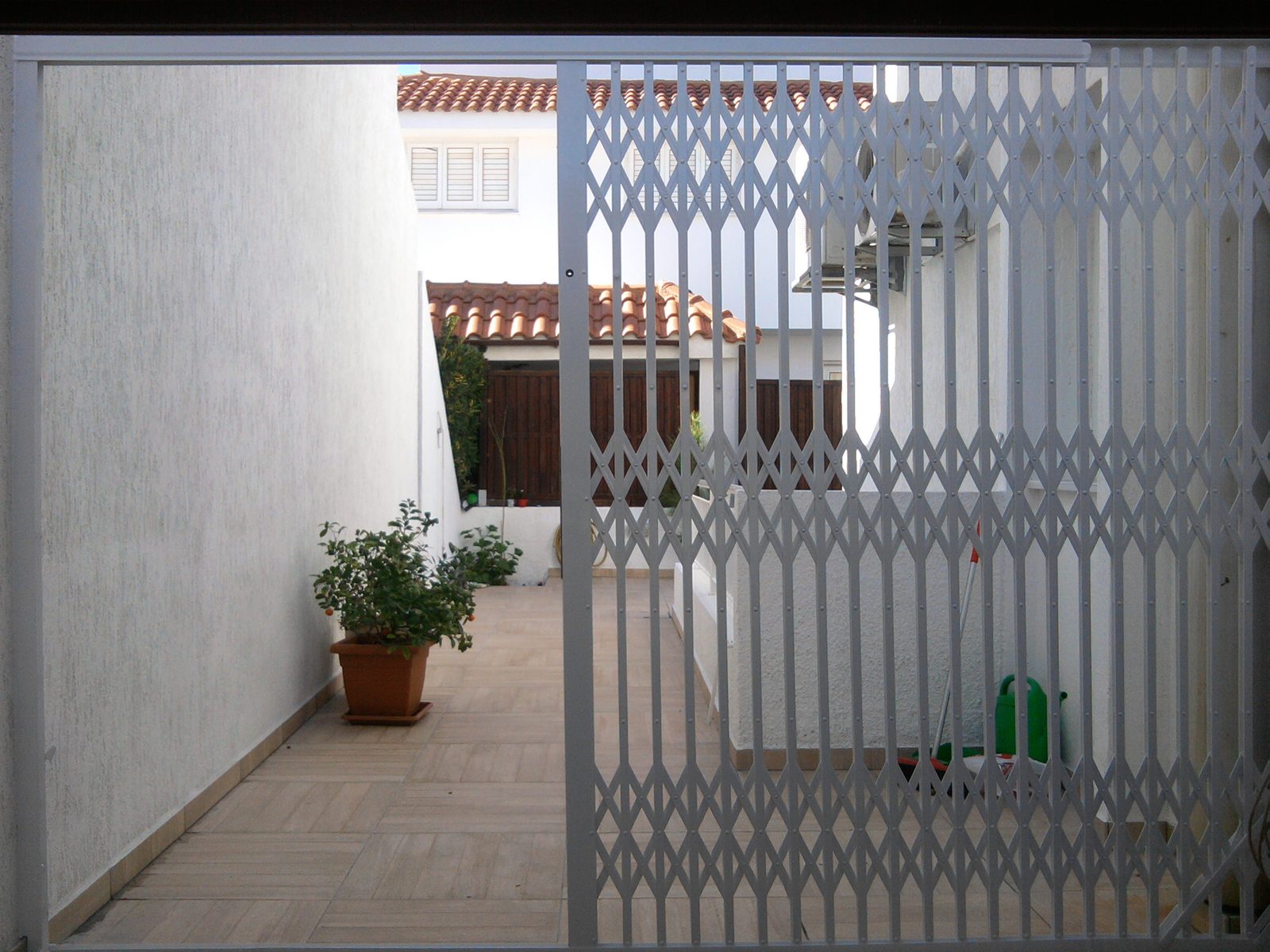 Security grille across a covered entrance