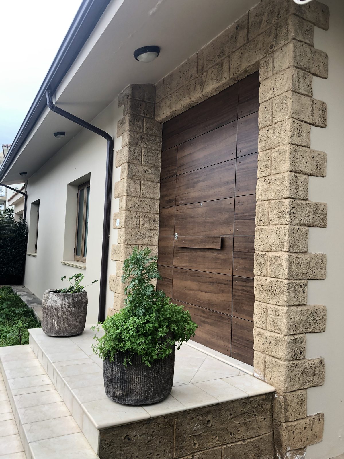 Timber gate with planted forecourt