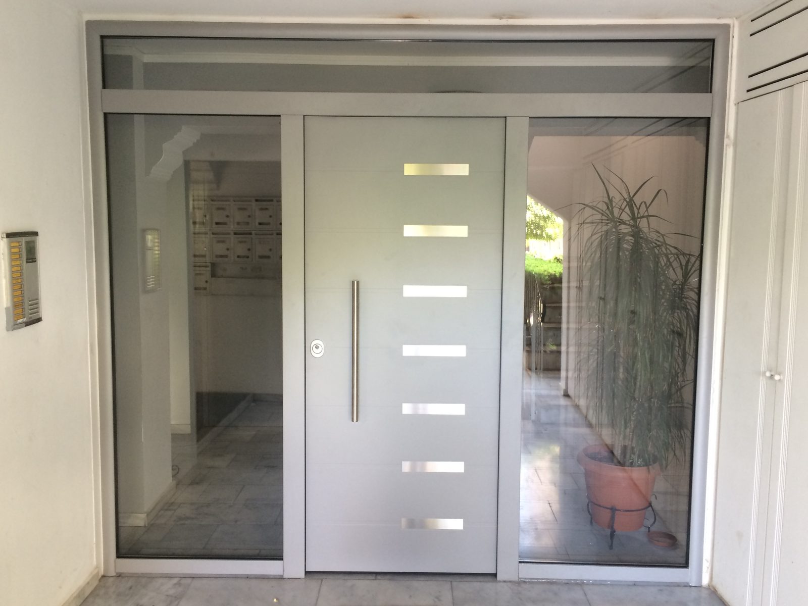 Glazed entrance screen with sidelights